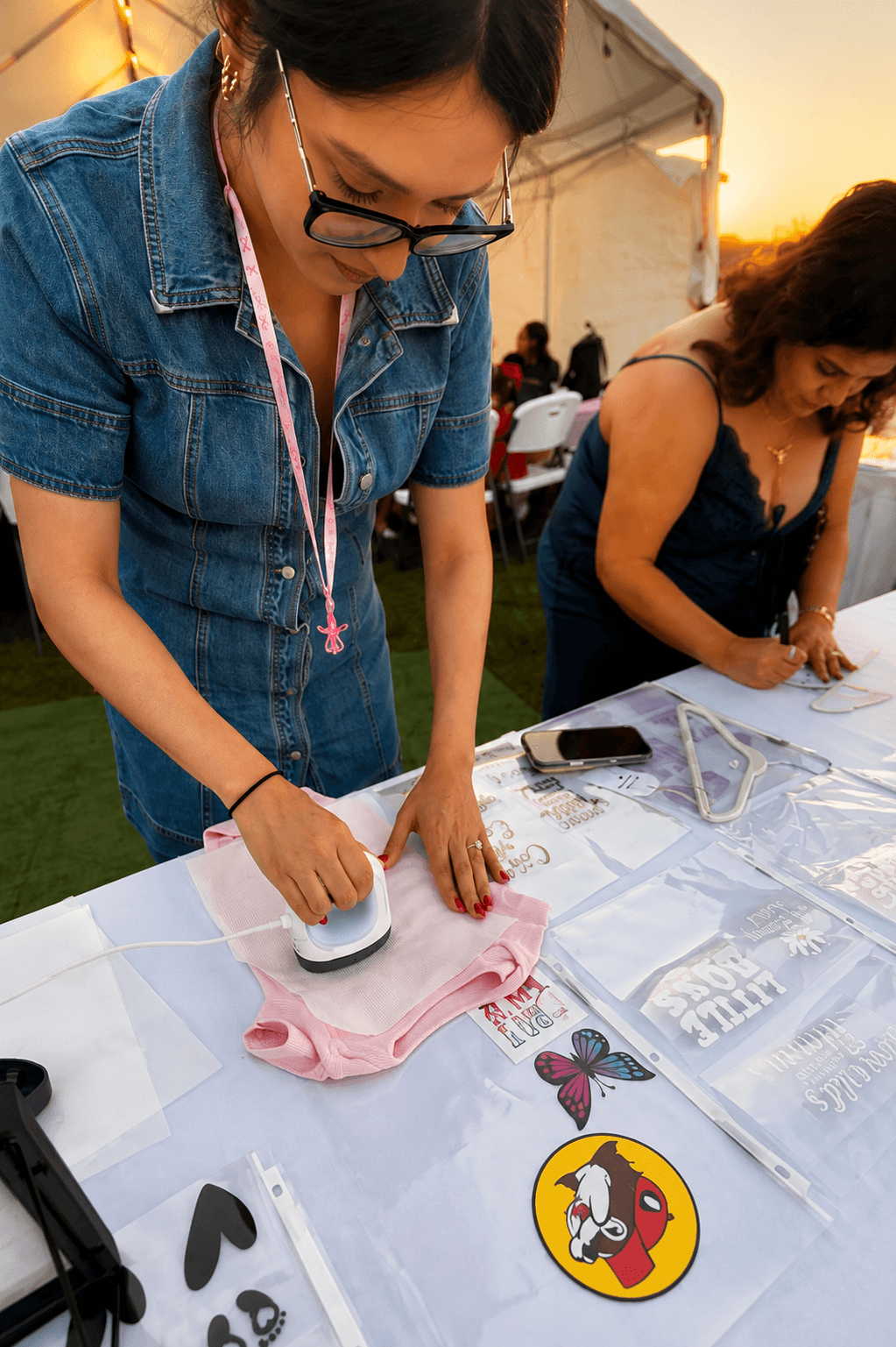 Onesie decorating station prepared for a baby shower